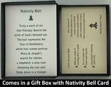 The Gold Nativity Bell Pendant will be carefully packed in a black gift box, with the story card in the lid. A silver elastic bow closes the box.