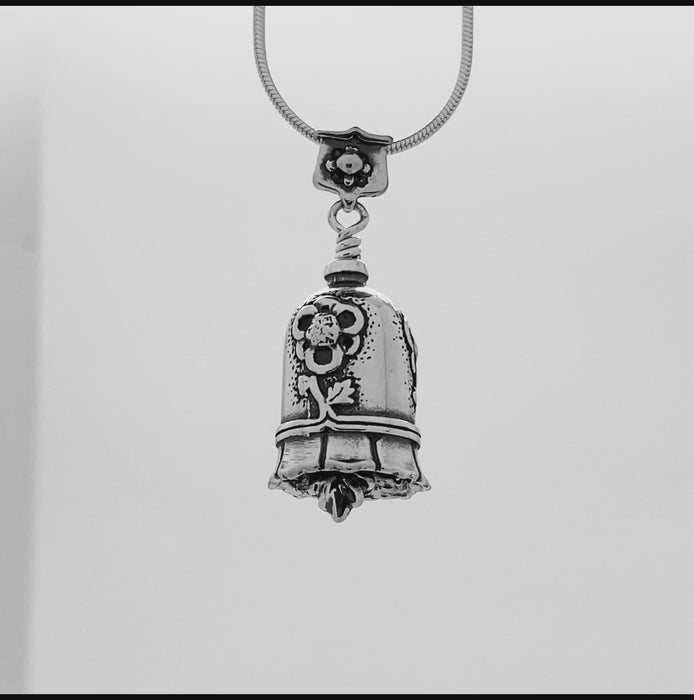 In this video you can see our handcrafted sterling silver Daughter In Law Pendant. This gift shows your daughter in law or future daughter in law she is a welcome and loved part of the family. Adorned with flowers around the bell the Daughter in Law Bell Pendant is handcrafted in sterling silver.