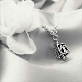 Handcrafted in Sterling Silver, the Angel Charm Bell is adorned with angels on all four sides, two with open arms and two with their hands clasped in prayer.