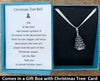 The Christmas Tree Bell charm will be carefully packed in a black gift box, with the gift card in the lid. A silver bow closes the box.