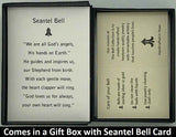 The Seantel Bell Pendant will be carefully packed in a black gift box, with the gift card in the lid. A silver elastic bow closes the box.