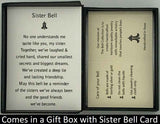 The Gold Sister Bell Pendant will be carefully packed in a black gift box, with the story card in the lid. A silver elastic bow closes the box.