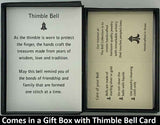 The Thimble Bell Pendant will be carefully packed in a black gift box, with the gift card in the lid. A silver elastic bow closes the box.