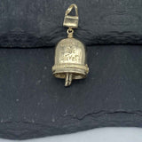 Handcrafted in 10 or 14K, the Gold Sister Bell Pendant has "sisters are forever" inscribed on one side and sisters holding hands on the other side with a purse for a bail and a tube of lipstick for the clapper.