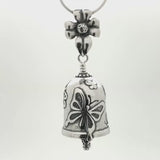 In this video you can see our handcrafted sterling silver Butterfly Pendant. This bell pendant is adorned with butterflies around the bell body, the bail is a flower with a caterpillar for the clapper.