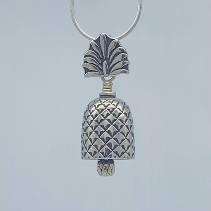 In this video you can see our handcrafted sterling silver Pineapple Bell Pendant from all sides (360 view). 