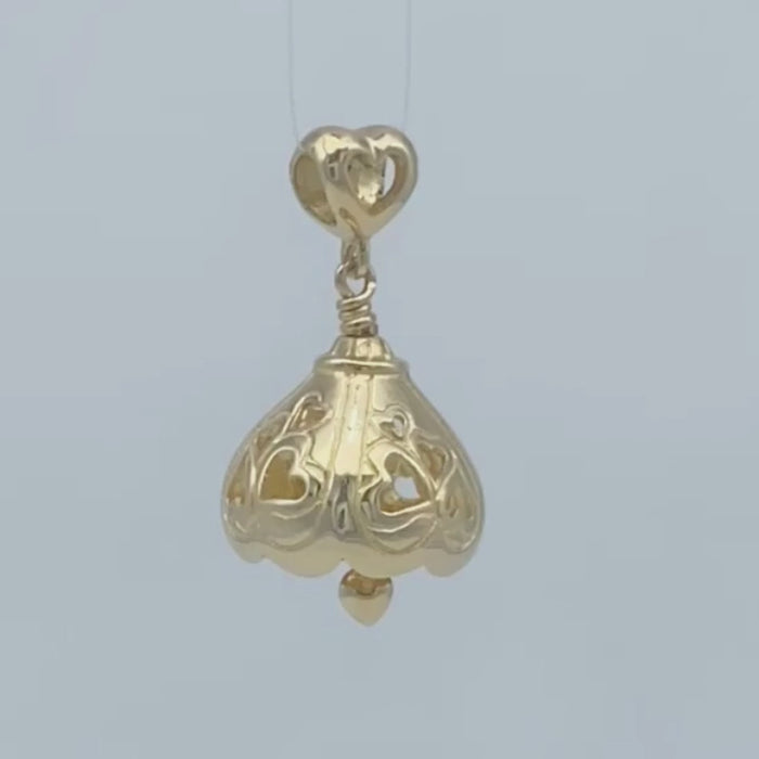 In this video you can see our handcrafted Gold You Are Loved Bell Pendant from all sides (360 view). 