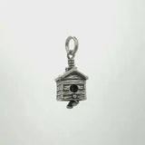 In this video you can see our handcrafted sterling silver Birdhouse Charm Bell from all sides (360 view). 
