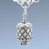 Handcrafted in Sterling Silver, the All Sewn Up Bell Charm bell body features a quilt pattern with a button trim and the clapper is a pair of scissors.