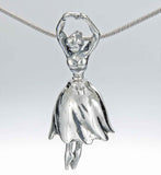 Handcrafted in sterling silver, this pendant is shaped like a graceful ballerina. The skirt forms the bell of the Tiny Dancer Bell and her feet form the clapper, while her arms and head make the bail.