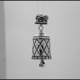 HandcIn this video you can see our handcrafted sterling silver pendant, the All Sewn Up Bell. It features a quilt pattern wrapped around the bell and a button rim, the bail is a sewing machine, and the clapper is a pair of scissors.
