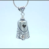 In this video you can see our handcrafted sterling silver Treasured Mom Bell Pendant from all sides (360 view). 