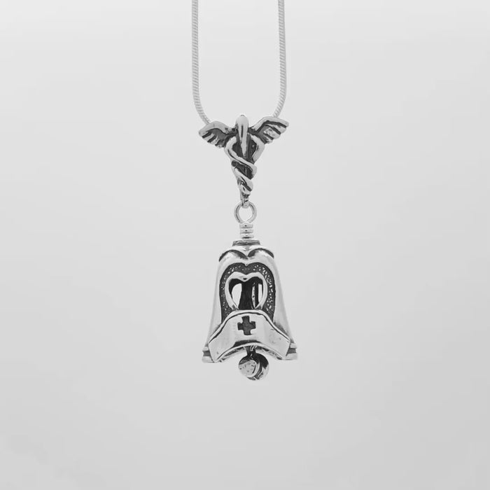 In this video you can see our handcrafted sterling silver Nurse Bell Pendant from all sides (360 view). 