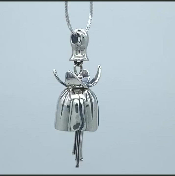In this video you can see our handcrafted sterling silver Bellflower Necklace. One of our most graceful bell necklaces. The curled top piece makes this pendant truly unique, with a long, dangling stamen for a clapper and the bulb at the top of the flower forming the bail.