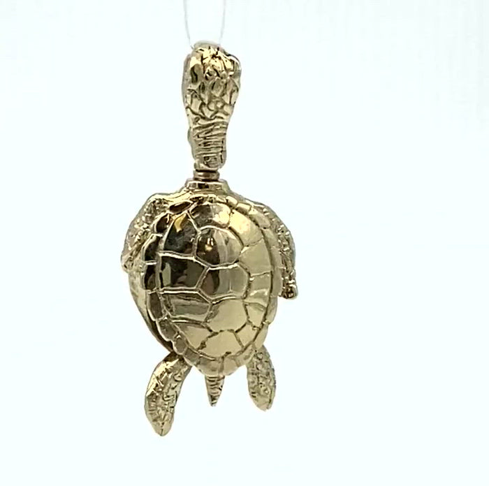 Handcrafted in 10 or 14K gold, this bell is shaped like the graceful sea turtle. The bail is the turtle's head and as you can see in this video, it's hind legs and tail form the clapper.