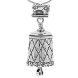 Handcrafted in Sterling Silver, the All Sewn Up Bell Pendant features a quilt pattern wrapped around the bell and a button rim, the bail is a sewing machine, and the clapper is a pair of scissors.