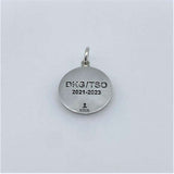 Handcrafted in sterling silver, the DKG Journey Medallion Charm features a design with "DKG/TSO 2021 - 2023" on the back.