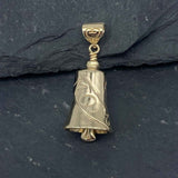 This Gold Treasured Mom Bell Pendant is handcrafted in 10 or 14K and makes a beautiful tribute to Mom. It features a ribbon that reads "MOM" wrapped around the bell, making it a perfect choice for any special occasion. On each side is a delicate heart cut out, giving it an open, airy style.