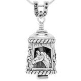 Handcrafted in Sterling Silver, the Horse Bell Pendant features a horse looking out through its stable with several horses galloping across a field on the opposite side. The bail is a horseshoe and the clapper is a horseshoe nail.