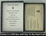 The Key To My Heart Bell Charm will be carefully packed in a black gift box, with the story card in the lid. A silver elastic bow closes the box.
