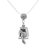 Handcrafted in Sterling Silver, the Knitter Bell Pendant is decorated with a ball of yarn, a knit sweater, and a sheep. The bail is a ball of yarn and the clapper is a pair of knitted socks.