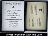 The Quilting Hands Bell Pendant will be carefully packed in a black gift box, with the gift card in the lid. A silver elastic bow closes the box.