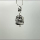 In this video you can see our handcrafted sterling silver Sister Bell Pendant from all sides (360 view). 