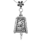 Handcrafted in sterling silver, the Alaska Bell Pendant depicts the beauty of our largest state with four panels showing the rugged mountains. A forget me not flower hangs above as the bail and a king salmon clapper rings this bell pendant.