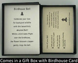 The Birdhouse Charm Bell will be carefully packed in a black gift box, with the gift card in the lid. A silver elastic bow closes the box.