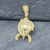 Handcrafted in 10 or 14K gold, this bell is shaped like the graceful sea turtle. The bail is the turtle's head and it's hind legs and tail form the clapper.