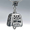 Handcrafted in Sterling Silver, the Harmony Bell Pendant is decorated with the words Hope, Love, Joy, Faith, Peace, as well as hearts, crosses, and the peace symbol. The bail says "Joy" while a heart hangs from the bell's clapper.