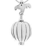 Handcrafted in Sterling Silver, the sterling silver Jack O'Lantern Bell Pendant is shaped like the traditional carved pumpkin with a ghost for the bail and a tea candle for the clapper.